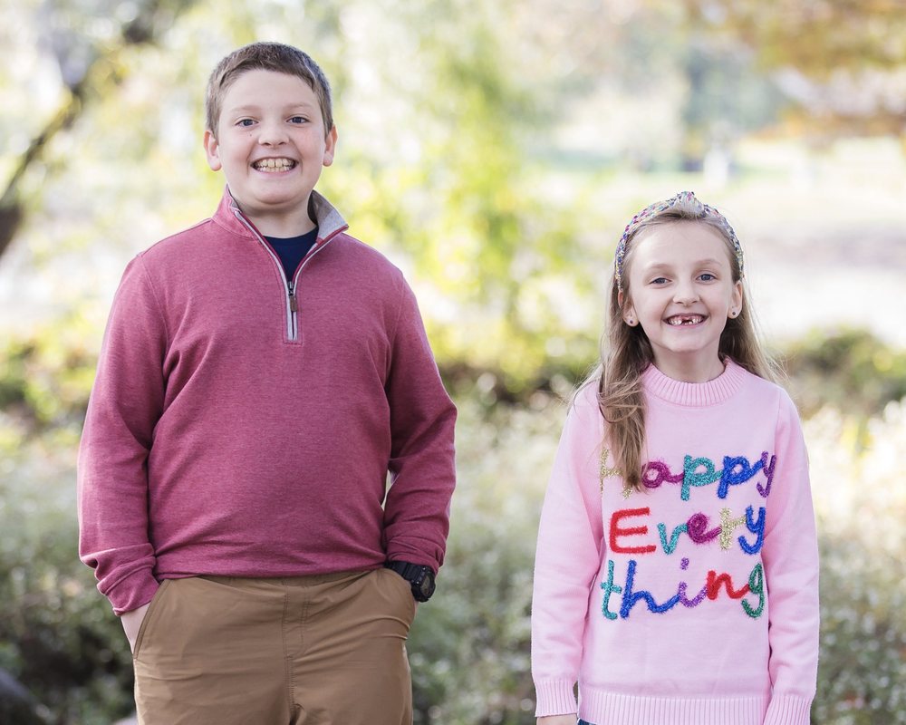William and Charlotte smiling outside in the fall